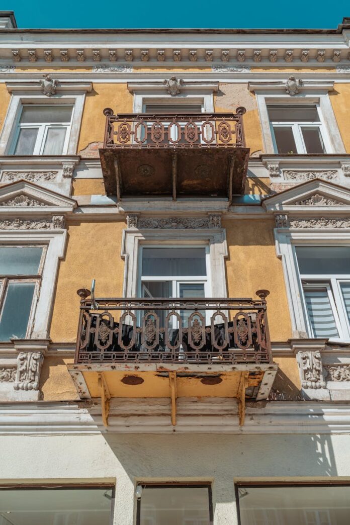 Close-up of a vintage European building facade with ornate balconies in Radom, Poland.